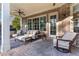 Relaxing covered patio with comfortable seating and brick accents at 2679 Wynnton Dr, Duluth, GA 30097