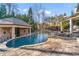 Backyard featuring a pool with a cabana, and ample patio space for relaxation and entertainment at 2679 Wynnton Dr, Duluth, GA 30097