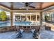Inviting backyard oasis with a covered patio, sparkling pool, and stone detailing at 2679 Wynnton Dr, Duluth, GA 30097