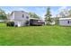 The home's spacious backyard features lush green grass, a back porch, and a storage shed at 3390 Navaho Se Trl, Smyrna, GA 30080