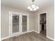 Dining Area with new floors and french doors that lead to the backyard at 3390 Navaho Se Trl, Smyrna, GA 30080