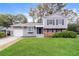 Charming two-story home featuring a manicured lawn, garage, and inviting front entrance at 3390 Navaho Se Trl, Smyrna, GA 30080