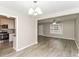 Open layout featuring new floors that connect the dining area, living room, and kitchen at 3390 Navaho Se Trl, Smyrna, GA 30080