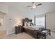 This bedroom has neutral walls, carpet, and a ceiling fan at 1496 Rocky River Dr, Lawrenceville, GA 30045