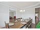 Comfortable dining room features hardwood floors and an open layout to the living area at 1496 Rocky River Dr, Lawrenceville, GA 30045