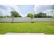 Spacious backyard view of the home with new grass and brick retaining wall at 1514 Gatekeeper Ter, Marietta, GA 30066