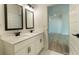 Modern bathroom with double vanity, sleek fixtures, and an entry leading to another room at 1514 Gatekeeper Ter, Marietta, GA 30066