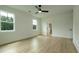 Spacious bedroom featuring wood flooring, light walls, and ceiling fan at 1514 Gatekeeper Ter, Marietta, GA 30066