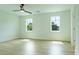 Empty bedroom with wood flooring and two windows at 1514 Gatekeeper Ter, Marietta, GA 30066