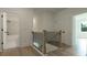 Hallway with wood flooring that leads to a bathroom at 1514 Gatekeeper Ter, Marietta, GA 30066