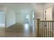 Hallway with wood flooring and stairs at 1514 Gatekeeper Ter, Marietta, GA 30066