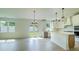 Spacious open-concept kitchen with white cabinets, stainless steel appliances, and a large center island, perfect for entertaining at 1514 Gatekeeper Ter, Marietta, GA 30066
