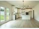 Bright kitchen features sleek white cabinets, modern appliances, and an island, blending style and functionality for cooking at 1514 Gatekeeper Ter, Marietta, GA 30066