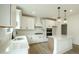 Modern kitchen featuring white cabinets, quartz countertops and a stylish pendant lights at 1514 Gatekeeper Ter, Marietta, GA 30066