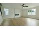 Spacious living room with a modern fireplace, large windows, and wood flooring at 1514 Gatekeeper Ter, Marietta, GA 30066