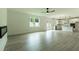 Spacious open-concept kitchen with white cabinets, stainless steel appliances, and a large living space, perfect for entertaining at 1514 Gatekeeper Ter, Marietta, GA 30066