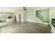 Open-concept living space with stairs, seamlessly connecting the living room, dining area, and kitchen, great for entertaining at 1514 Gatekeeper Ter, Marietta, GA 30066