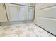 Bathroom featuring a vanity with light blue cabinets, gold hardware, and decorative floors at 6490 Mockingbird Rd, Cumming, GA 30028