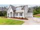 Charming two-story home with landscaped yard and covered entry at 6490 Mockingbird Rd, Cumming, GA 30028