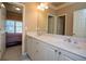 Dual-sink bathroom boasts ample counter space and storage at 942 Heathchase Dr, Suwanee, GA 30024