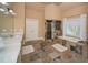 The bathroom features a double vanity, a soaking tub, and a tile floor at 942 Heathchase Dr, Suwanee, GA 30024