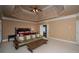 The main bedroom features a decorative trey ceiling at 942 Heathchase Dr, Suwanee, GA 30024