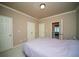 Bright bedroom showcasing multiple closets and access to bathroom at 942 Heathchase Dr, Suwanee, GA 30024