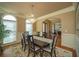 Formal dining room featuring a chandelier, chair rail, and large windows at 942 Heathchase Dr, Suwanee, GA 30024