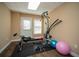 Bright exercise room with a home gym, fitness ball, and durable flooring at 942 Heathchase Dr, Suwanee, GA 30024