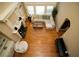 Bright living room with hardwood floors, fireplace, piano and large windows filling the space with natural light at 942 Heathchase Dr, Suwanee, GA 30024