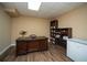 This home office offers ample storage with built-in shelving and great flooring at 942 Heathchase Dr, Suwanee, GA 30024