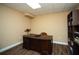 This home office features durable flooring, a desk and chair with great natural light at 942 Heathchase Dr, Suwanee, GA 30024