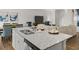 Spacious kitchen island offers seating and complements an open-concept living area at 3121 Greyton Dr, Buford, GA 30519