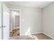 Neutral bedroom with carpeted floor and view to a hallway at 5438 Zachary Dr, Stone Mountain, GA 30083