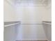 A large walk-in closet with shelving and carpet at 5438 Zachary Dr, Stone Mountain, GA 30083