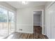 A dining area with sliding glass doors leading to an outdoor deck, and updated flooring at 5438 Zachary Dr, Stone Mountain, GA 30083