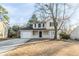 Charming two-story home featuring a cozy front porch and attached garage at 5438 Zachary Dr, Stone Mountain, GA 30083