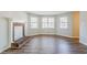 Bright living room featuring a cozy brick fireplace and large bay windows at 5438 Zachary Dr, Stone Mountain, GA 30083