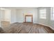 Open living space featuring a decorative fireplace and ample natural light at 5438 Zachary Dr, Stone Mountain, GA 30083
