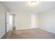 A main bedroom featuring carpeted floor, neutral walls and an ensuite bathroom at 5438 Zachary Dr, Stone Mountain, GA 30083