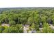 Aerial view of wooded property with home nestled among mature trees at 1551 Avon Ave, Atlanta, GA 30311