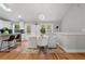 Sunlit dining area featuring a modern chandelier and seating for four at 1551 Avon Ave, Atlanta, GA 30311