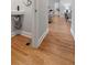 Hallway featuring hardwood flooring, with convenient hall bathroom at 1551 Avon Ave, Atlanta, GA 30311