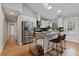 Modern kitchen with stainless steel appliances, granite countertops, and a breakfast bar at 1551 Avon Ave, Atlanta, GA 30311