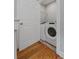 Convenient laundry room featuring modern washer and dryer units, just off the main hallway at 1551 Avon Ave, Atlanta, GA 30311