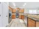 Well-equipped kitchen featuring stainless steel appliances, granite countertops, and light wood cabinets at 3277 Bluejay Lane # 41, Alpharetta, GA 30022