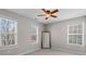 Bedroom with neutral walls and carpet and a window with blinds at 3760 Lake Point Blvd, Suwanee, GA 30024