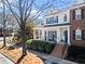 Charming two-story townhome with a welcoming front porch and brick accents. Beautiful curb appeal! at 3760 Lake Point Blvd, Suwanee, GA 30024