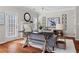 Bright and airy living room featuring hardwood floors, a fireplace, and stylish decor at 3760 Lake Point Blvd, Suwanee, GA 30024