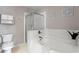 Bright primary bathroom with a soaking tub and separate shower at 3760 Lake Point Blvd, Suwanee, GA 30024